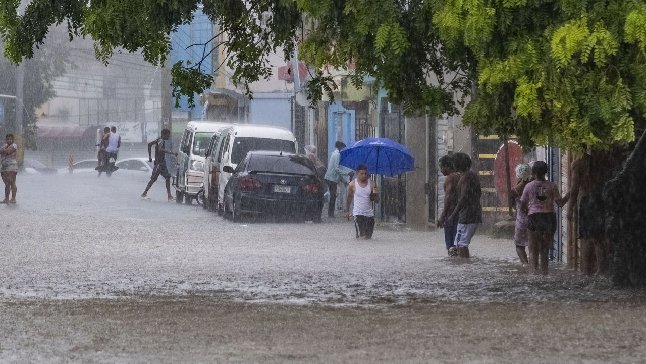 Tropical Storm Franklin's heavy rains flooded a street in Santo Domingo, Dominican Republic, on Aug. 22, 2023. (AP Photo/Ricardo Hernandez)